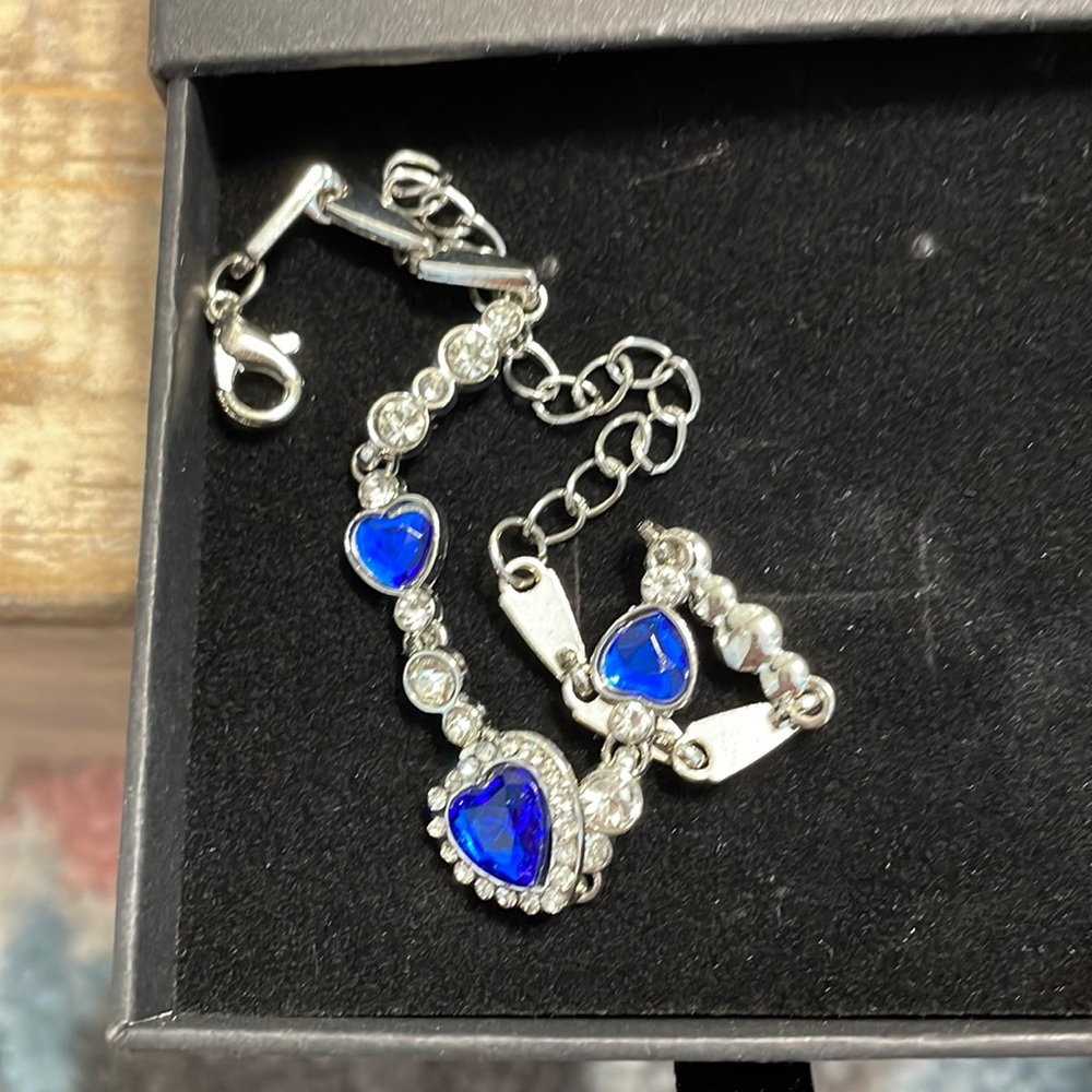 Silver bracelet. Fabricated blue and white gems. New without tags.